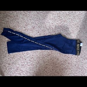 Blue and gold Nike pro leggings